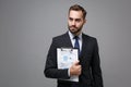 Confident young business man in suit shirt tie posing isolated on grey background. Achievement career wealth business Royalty Free Stock Photo