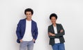 Confident young business partners with afro hair smiling and posing together over white background Royalty Free Stock Photo