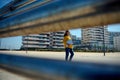 Confident business lady in casual attire, with laptop against high rise building backdrop. City lifestyle People Career Royalty Free Stock Photo