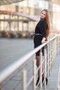 Confident young business woman standing near modern office building. Royalty Free Stock Photo