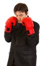 Confident young businessman with boxing gloves Royalty Free Stock Photo