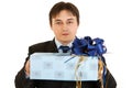 Confident young businessman holding present Royalty Free Stock Photo