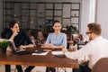 Confident young businessman presenting project to clients in office meeting Royalty Free Stock Photo