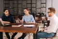 Confident young businessman presenting project to clients in office meeting Royalty Free Stock Photo