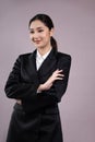 Confident young businesswoman stands on isolated background. Enthusiastic Royalty Free Stock Photo