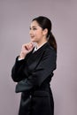 Confident young businesswoman stands on isolated background. Enthusiastic Royalty Free Stock Photo