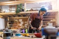 Young woman doing woodwork in a workshop Royalty Free Stock Photo