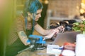 Young woman using laptop in her workshop Royalty Free Stock Photo