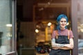 Confident young craftswoman in her workshop