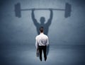 Businessman with weight lifting shadow Royalty Free Stock Photo