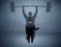 Businessman with weight lifting shadow Royalty Free Stock Photo