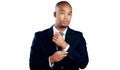 The confident young executive. Studio shot of a handsome young businessman fixing his sleeve against a white background.