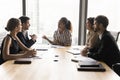 Confident young female African American boss talking to partners Royalty Free Stock Photo