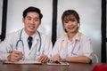 Confident young male & female doctor smiling at camera. Portrai Royalty Free Stock Photo