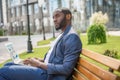 Confident young male worker with computer in town Royalty Free Stock Photo