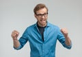 Confident young man celebrating victory Royalty Free Stock Photo