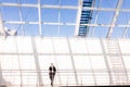 Confident young man in full suit while standing modern office hall Royalty Free Stock Photo