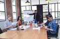 Confident young man giving creative presentation to his colleagues to coworkers in conference room., Teamwork concept.Sharing int Royalty Free Stock Photo