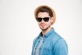 Confident young man in sunglasses and hat Royalty Free Stock Photo