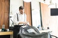 Salon Worker Using Razor To Shave Client`s Face