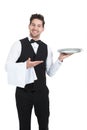 Confident young waiter with napkin and serving tray Royalty Free Stock Photo
