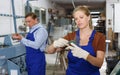 Woman measuring glass with trammel Royalty Free Stock Photo