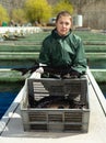 Woman fish farmer holding sturgeon