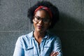 Confident young woman standing with her arms crossed Royalty Free Stock Photo