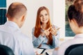 Young woman pointing her advantages during the recruitment interview Royalty Free Stock Photo