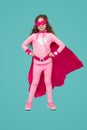 Confident youngster in pink superhero costume Royalty Free Stock Photo