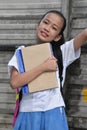 Confident Youthful Asian School Girl With School Books