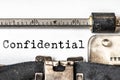 Confidential typed words on a vintage typewriter. Close up Royalty Free Stock Photo