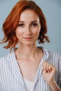 Confidently smiling good-looking 30 year old ginger woman. Dyed hair