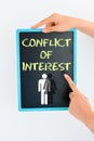 Conflict of interest concept on blackboard