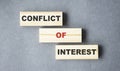 conflict of interest text from wooden blocks Royalty Free Stock Photo