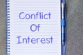 Conflict of interest write on notebook Royalty Free Stock Photo