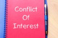 Conflict of interest write on notebook Royalty Free Stock Photo