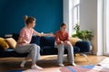 Conflict between parent and teenage. Teen girl sitting on sofa ignoring toxic mother scolding child Royalty Free Stock Photo