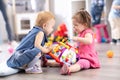 Conflict on the playground. Two kids fighting over a toy in kindergarten Royalty Free Stock Photo