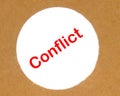 Conflict text on a round cardboard hole