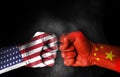 Coronavirus fight,Conflict between USA and China, male fists with flags painted on skin isolated on black background