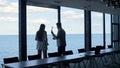 Conflicting man throwing papers go away in conference room. Two managers argue Royalty Free Stock Photo