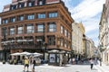 Confluence of the streets Ovocny and Celetna with view of a famous cafe and people walking by it in the old city of Prague Royalty Free Stock Photo