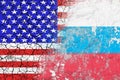 Confrontation between the USA and Russia. Threat of nuclear strike. The flags of two countries painted on the concrete wall.