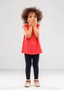 Confused african american girl covering mouth Royalty Free Stock Photo