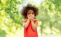 Confused african american girl covering mouth Royalty Free Stock Photo