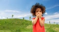 Confused african american girl covering mouth Royalty Free Stock Photo