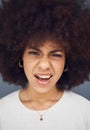 Confused, afro and face of a woman thinking of a decision against a grey studio background. Doubt, uncertain and