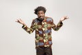 Confused afro man puzzled and say don`t know, maybe Royalty Free Stock Photo