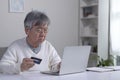 Asian elderly senior retired man, stressed worried sad frustrated male having problem with paying, buying online Royalty Free Stock Photo